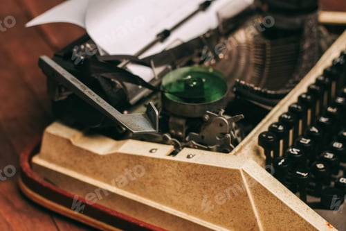 Preview: vintage typewriter for printing white sheet of paper wooden background retro invention