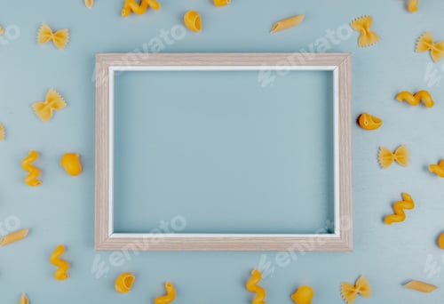 Preview: top view of macaronis as farfalle, fusilli, penne, pipe-rigate around frame on blue background with