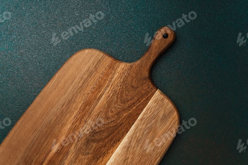 Preview: Unique wooden cutting board on dark background showcasing craftsmanship