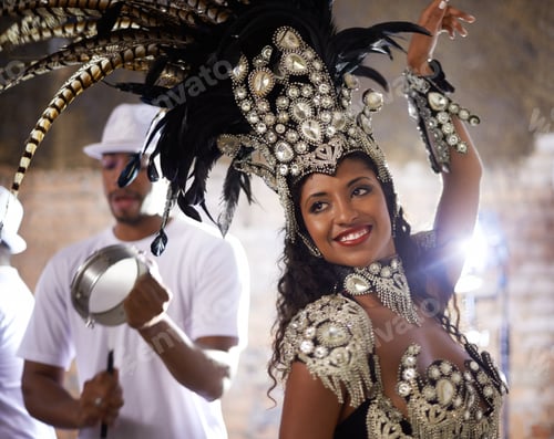 Preview: Turning beats into heat. Shot of a beautiful samba dancer performing in a carnival with her band.