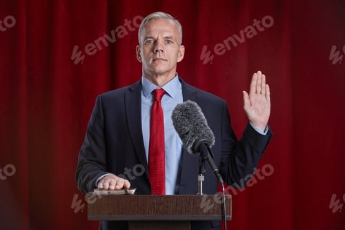 Preview: Mature Man Presenting on Stage