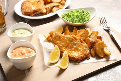 Preview: British traditional fish, potato chips and mushy peas on color background
