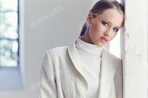 Preview: Portrait of blond female with blue eyes.