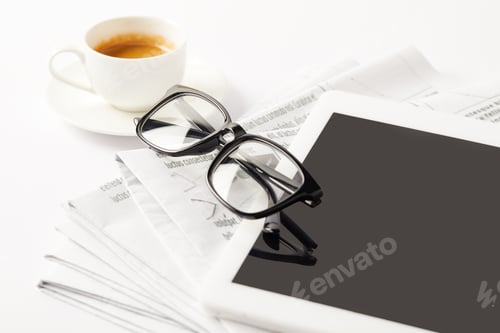 Preview: eyeglasses, coffee cup, digital tablet and pile of newspapers, on white
