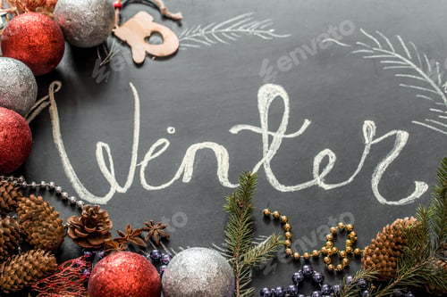 Preview: Chalk inscription winter on black Board holidays