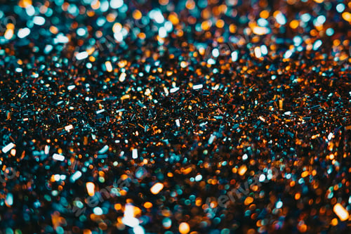 Preview: Festive golden dust, glitter background. Colorful blue and orange light. Copy space for art party