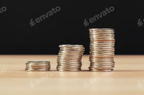 Preview: piles of coins on working table