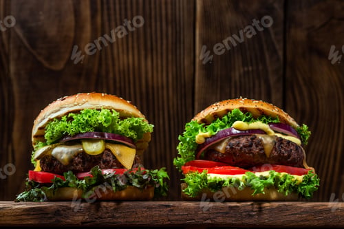 Preview: Two Burgers on Wooden Background Close Up View