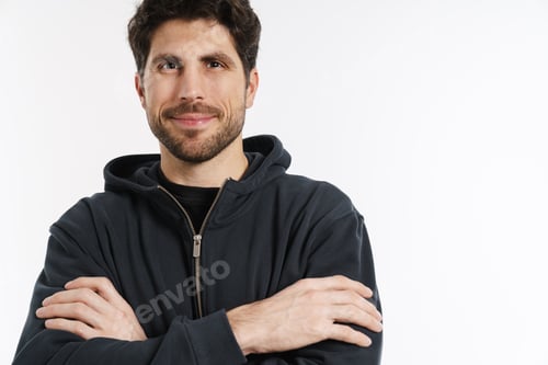 Preview: Pleased athletic sportsman smiling and looking at camera