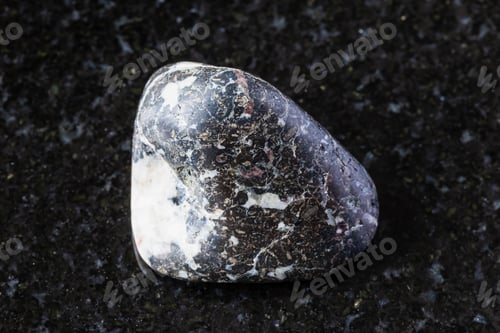 Preview: sample of polished trachybasalt rock on black