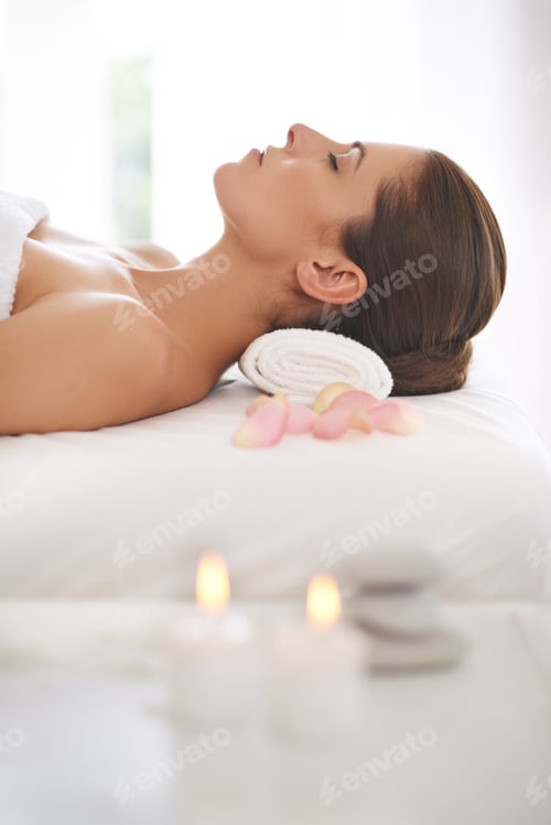 Preview: Not a care...A beautiful young woman relaxing at a spa.