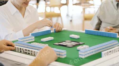 Preview: Asian elderly people playing mahjong in a care home
