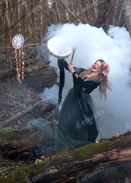 Preview: Wild Woman Playing Shamanic Drum Standing On Green Moss Tree Trunk In Forest, White Smoke Bomb
