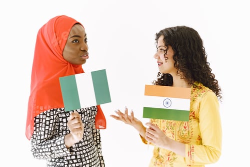 Preview: African and Asian women together on white background