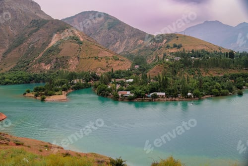 Preview: Majestic Lake Surrounded by Mountains in Daylight