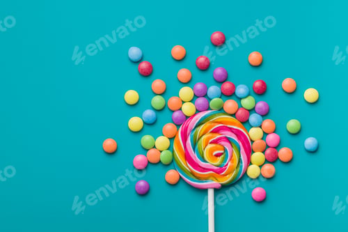 Preview: Sweet lollipop and colorful chocolate candy pills.