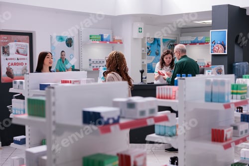 Preview: Elderly client asking drugstore worker for pharmaceutical vitamin