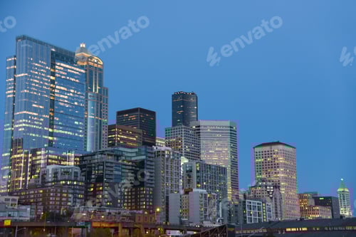 Preview: Downtown skyscrapers under blue dusk sky