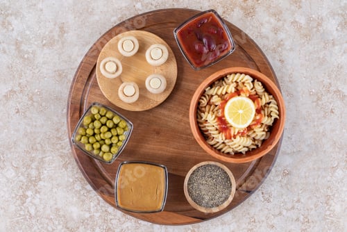 Preview: A wooden board of tasty pasta with mushrooms and spices