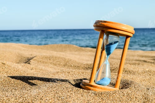 Preview: Hourglass on the sand on a beach in the Canary