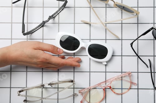 Preview: A pair of sunglasses on a checkered black and white background