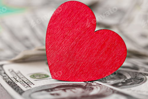 Preview: big red heart stands on money one hundred dollars USA