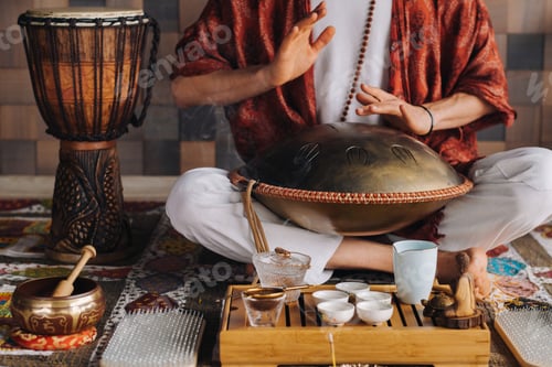 Preview: Close-up of a man's hand playing a modern musical instrument - the Orion tongue drum during the