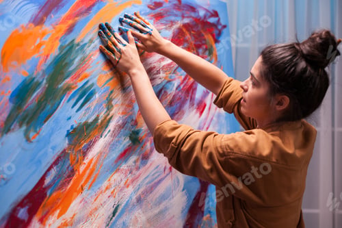 Preview: Creative artist painting with fingers