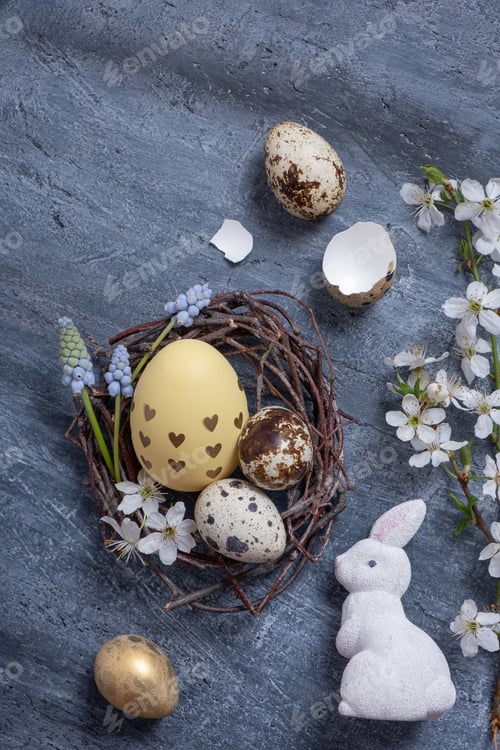 Preview: Easter composition with nest, white rabbit and eggs flat lay, top view.
