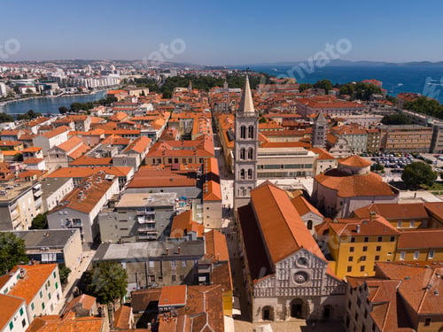 Preview: Aerial view of Zadar, Croatia, showcasing historic architecture, red rooftops, and the Adriatic Sea