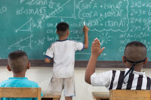Preview: Raised hands in classroom at country School between classmate