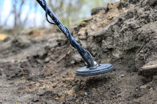 Preview: coil electronic metal detector device for search a treasure on ground background