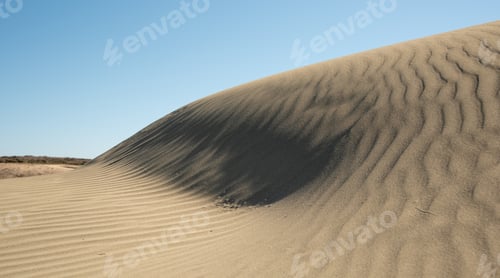Preview: Sand dunes against blue sky. Copy space, Desert dry coast land Cyprus