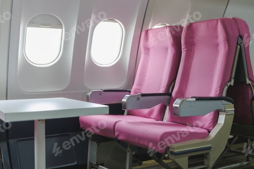 Preview: Empty pink airplane seats by the window waiting for passengers