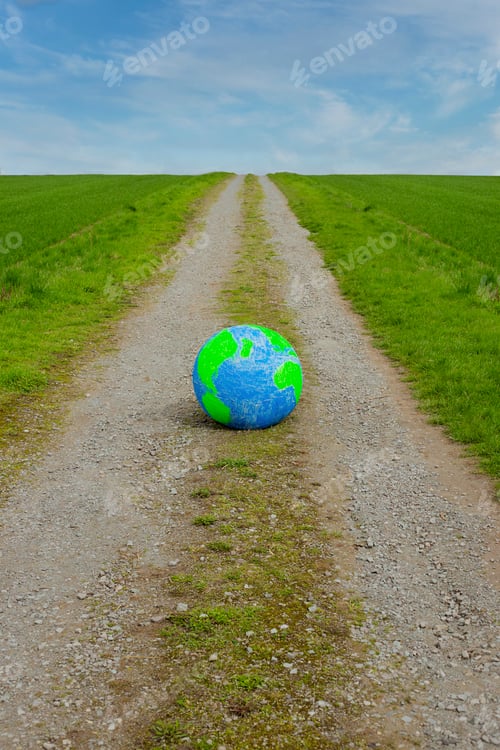 Preview: Planet Earth eco concept of nature protection. Surreal image. Planet on road.
