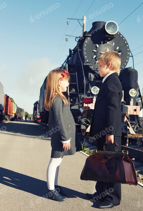 Preview: little boy and little girl near the retro train