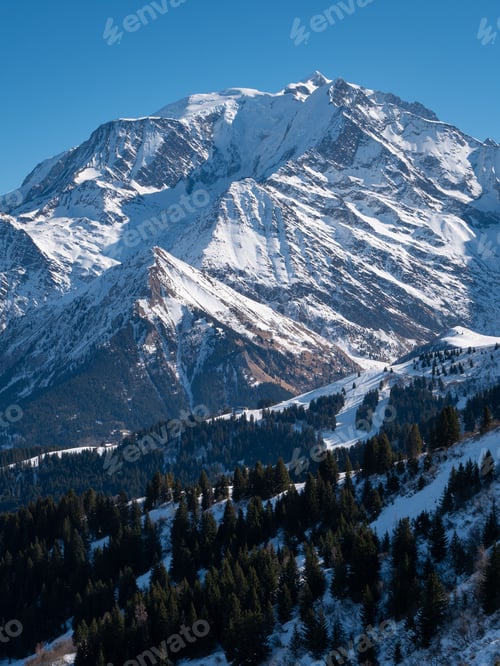 Preview: Majestic snow-capped Mont Blanc mountain range, with lush evergreen trees dotting the landscape