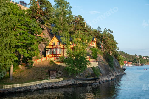 Preview: Old traditional villa at seaside of Sandhamn, Archipelago Stockholm Sweden. Reflection, sea, nature.
