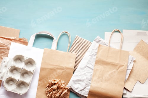 Preview: Flat lay of paper wastes ready for recycling
