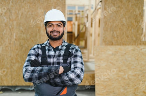 Preview: Construction of modular houses. Indian construction worker or engineer at construction site