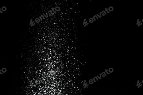 Preview: Flour sifting on a black background. White powder splash isolated on black background