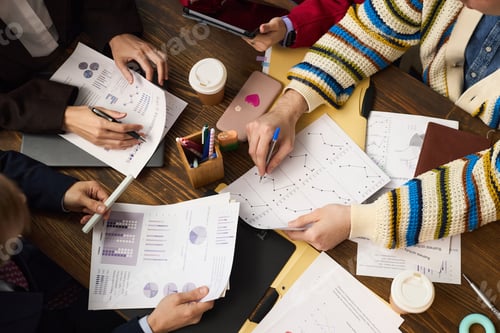 Preview: Multiethnic Young Adults Collaborating on Financial Analysis in Office Setting