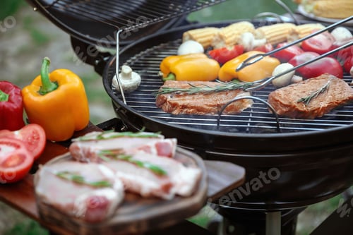 Preview: Cooking fresh food on barbecue grill outdoors, closeup