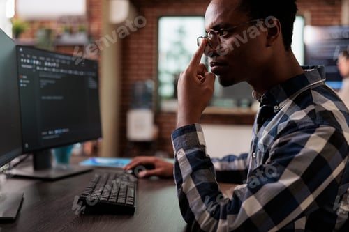 Preview: Thoughtful blockchain developer reflecting at low levels of security