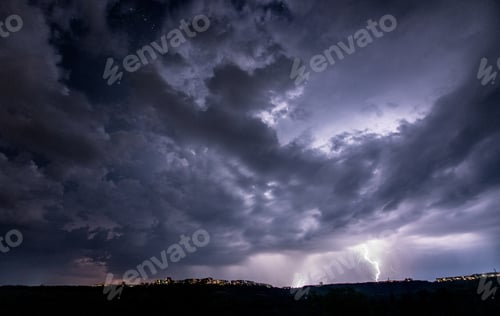 Preview: Beautiful thunderstorm with clouds and lightning over the night city