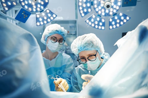 Preview: Focused Surgeons Working in Operating Room Setting