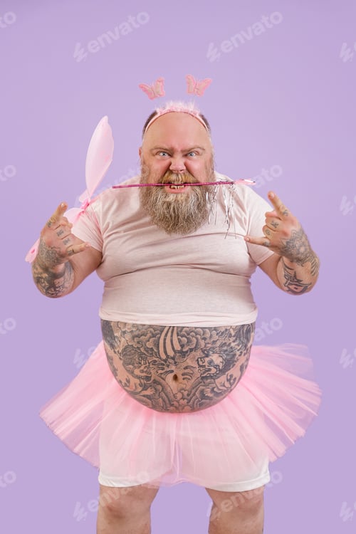 Preview: Brutal person in fairy suit shows horns gesture on purple background