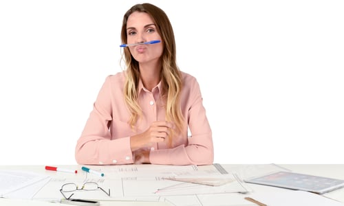 Preview: Woman with Pen Mustache Sits at Desk