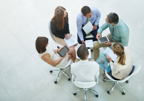 Preview: High angle shot of a group of businesspeople meeting in the office