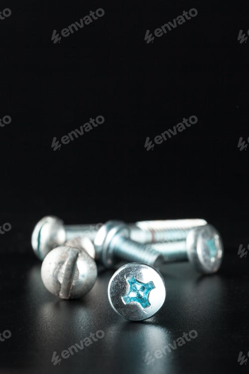 Preview: screws on black background